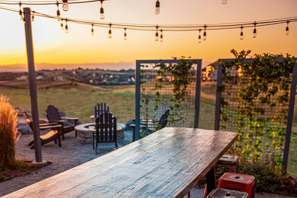 Long wooden table in Inspiration's hops garden.
