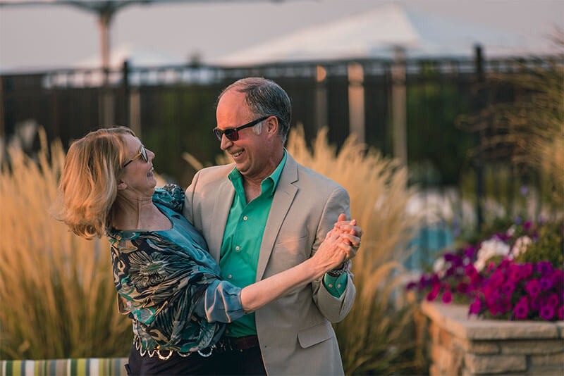 Residents dancing in Hilltop at Inspiration 55+ Community in Parker Colorado